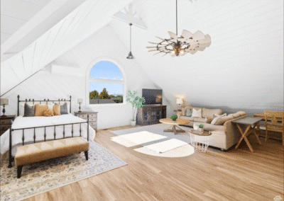 Spacious attic bedroom with vaulted ceiling, large arched window, wood floors, bed, sofa, TV, and dining area with natural light streaming in.